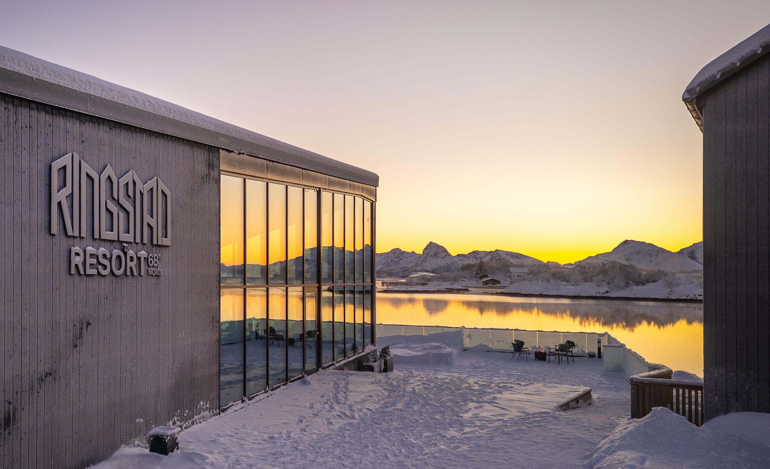 Ringstad Resort main building by the water at sunset in winter